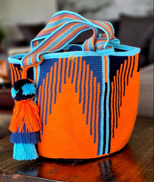 Orange wallet with light blue and black vertical stripes
