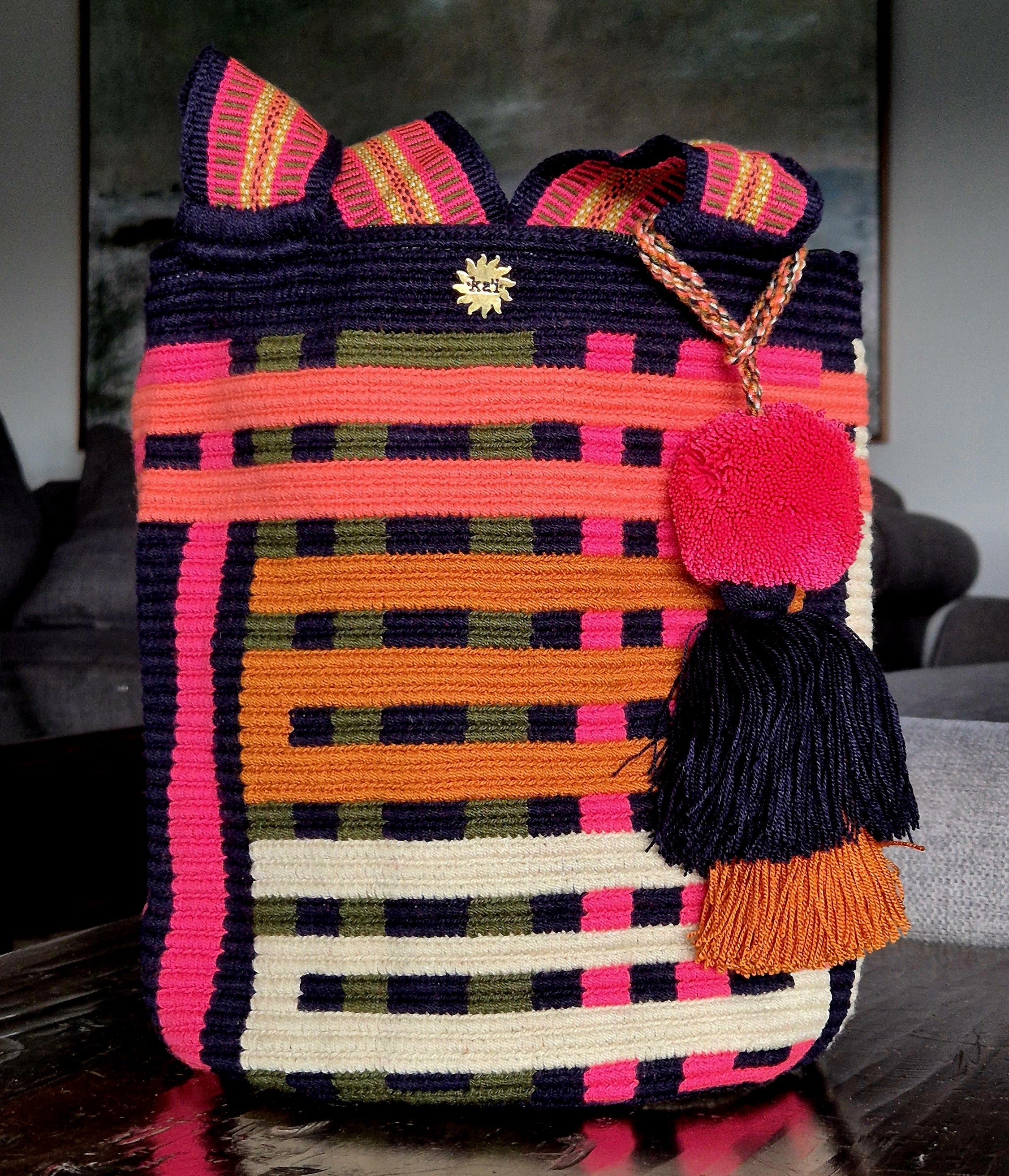 Navy blue wallet with horizontal and vertical stripes in olive, fuchsia, mustard, pink and beige