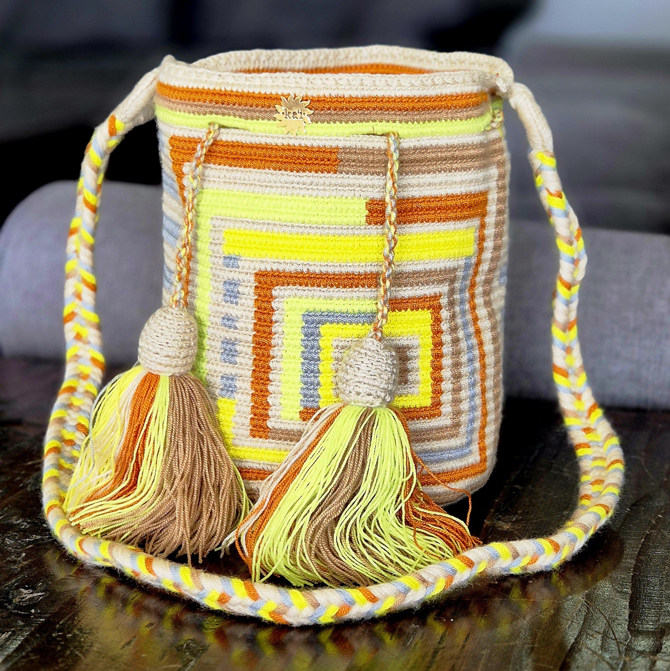 Beige bag with square lines in yellow, terracotta, brown and blue