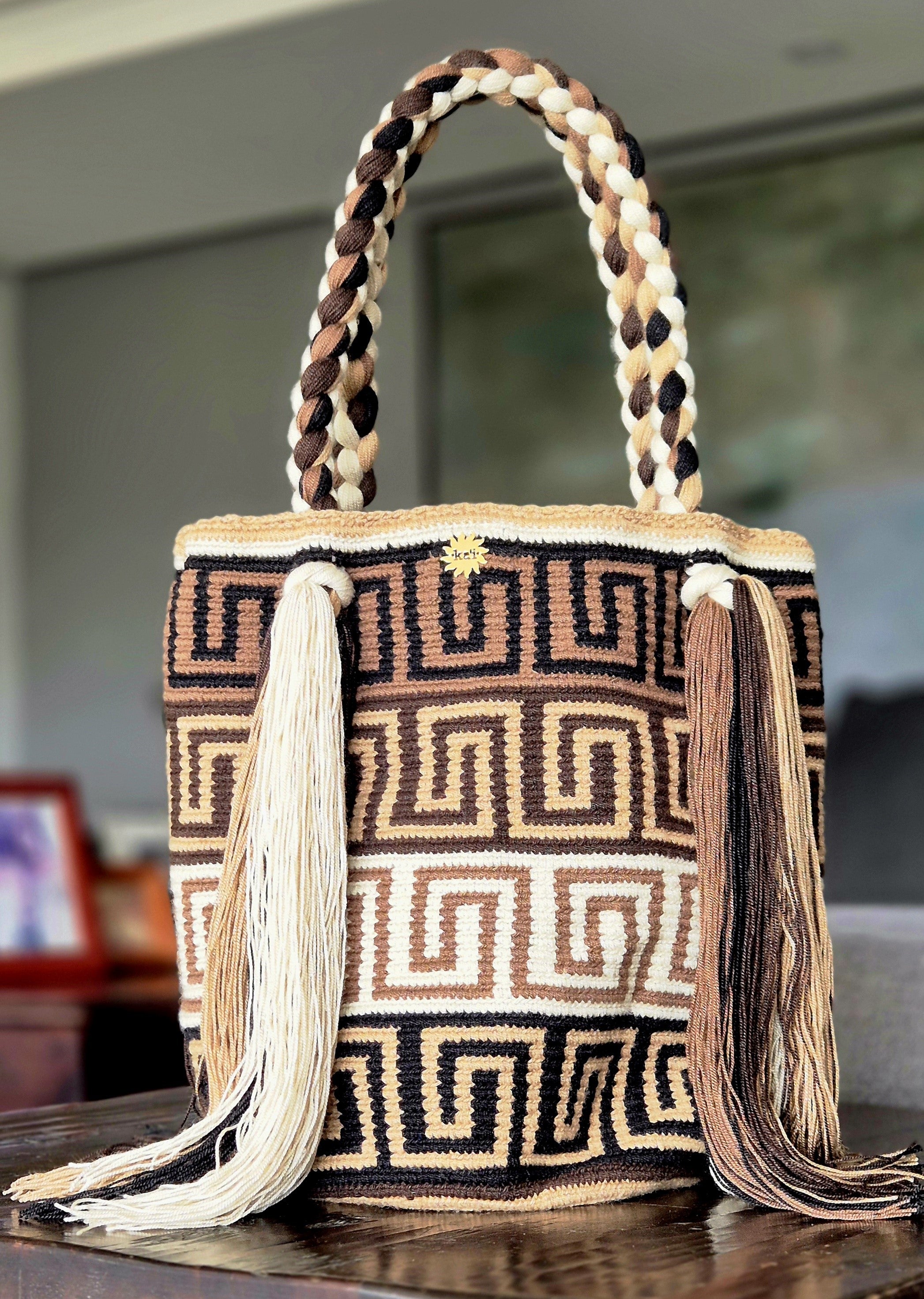 Brown, khaki, beige and black striped wallet with beige and khaki Greek pattern